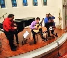 The Clazzical Project after a concert, featuring three male instrumentalists